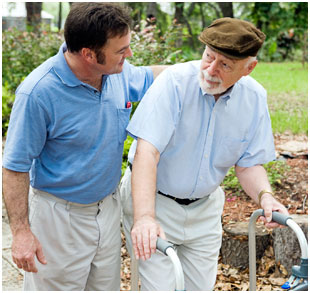 Elderly man being assisted photo